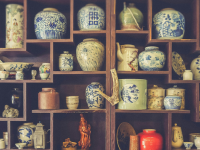 beautiful pottery in a wooden cupboard