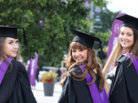 students in their graduation attire