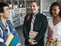 Three people talking and smiling