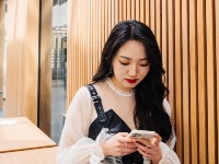 A student holding their phone