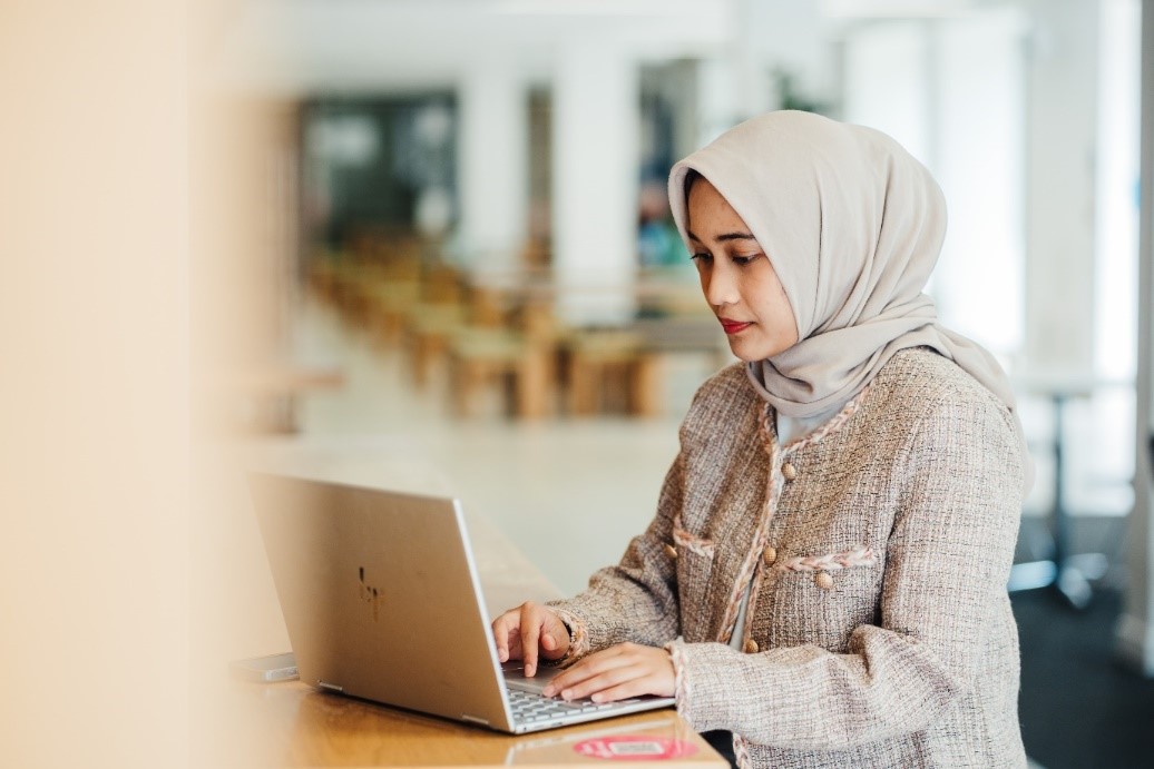 A person looking at their laptop screen