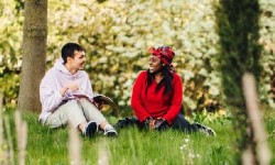 Two students sitting outdoor
